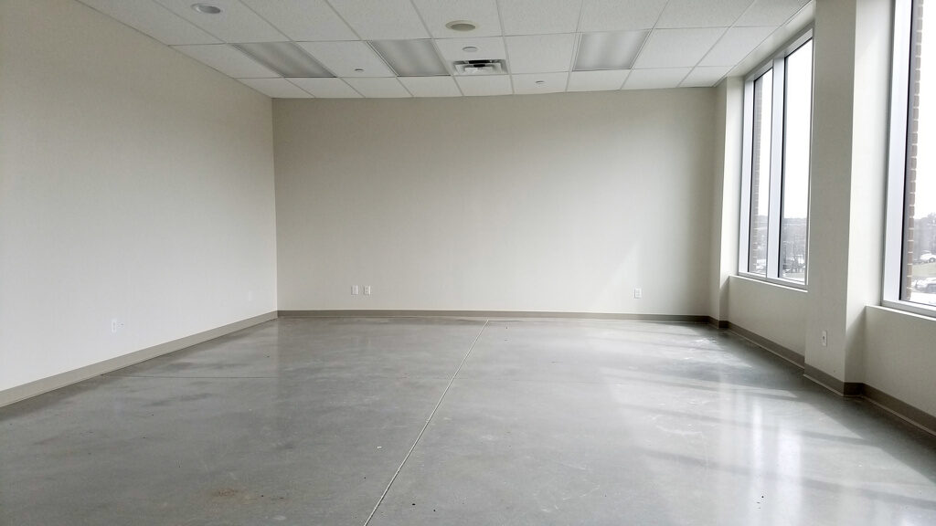 Commercial junk removal crew loading debris into truck in Orange